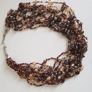 Necklace brown and cream beaded in an intricate unique layered fashion